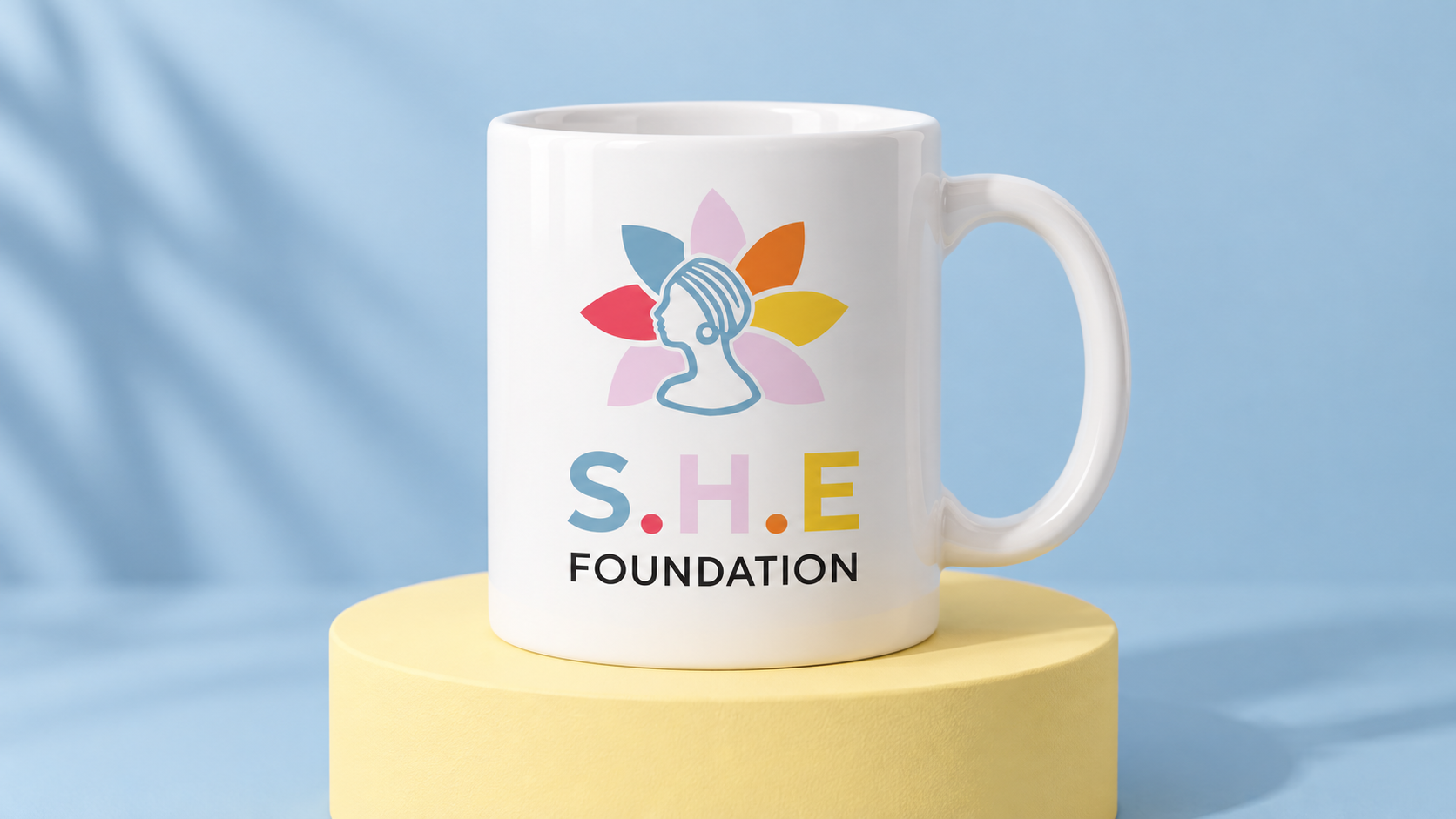 SHE Foundation concept mockup: ceramic mug