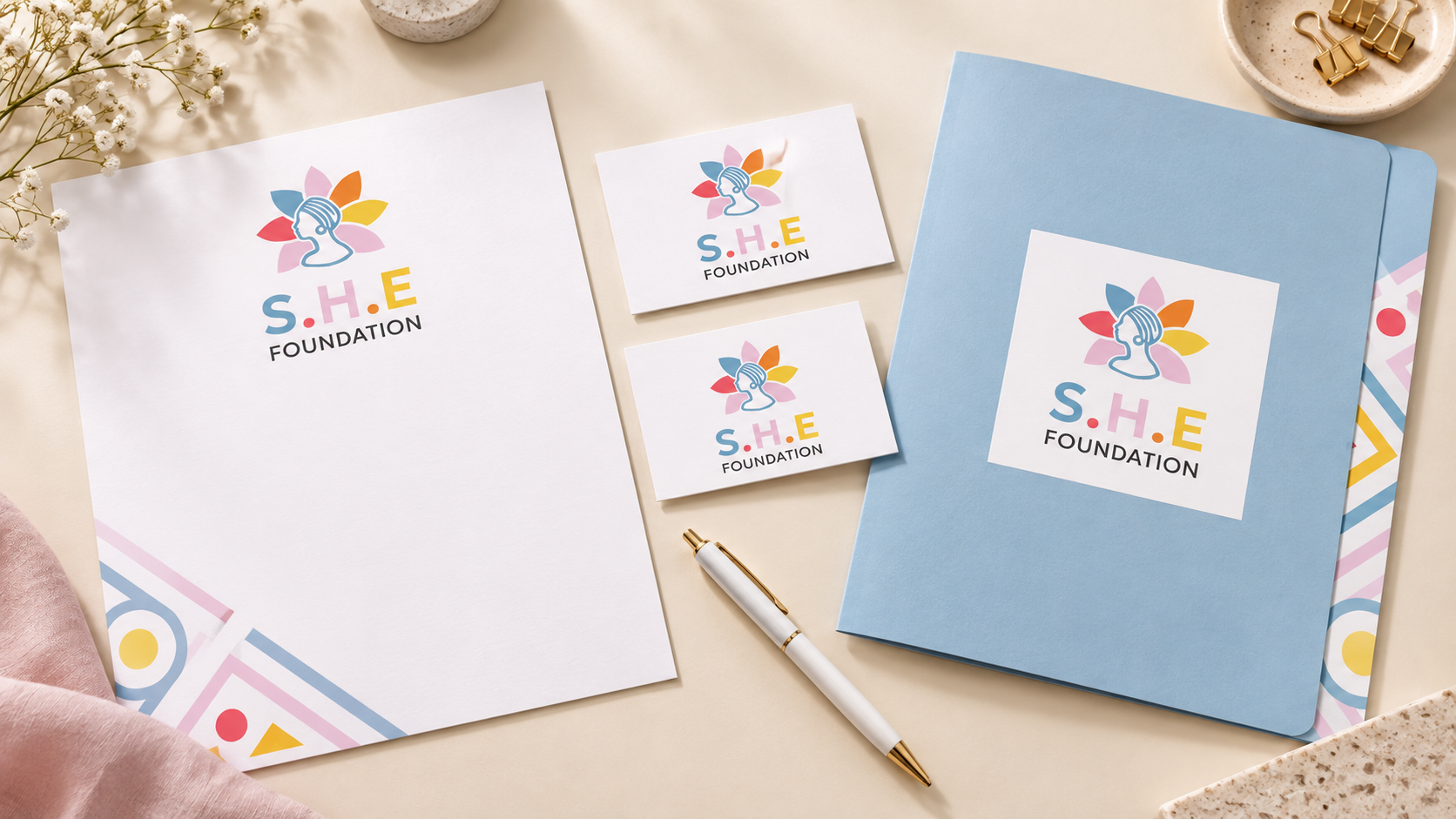SHE Foundation concept mockup: stationery set